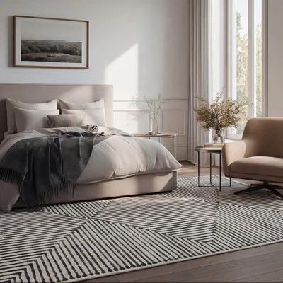 Grijs FLAID vloerkleed in een lichte slaapkamer